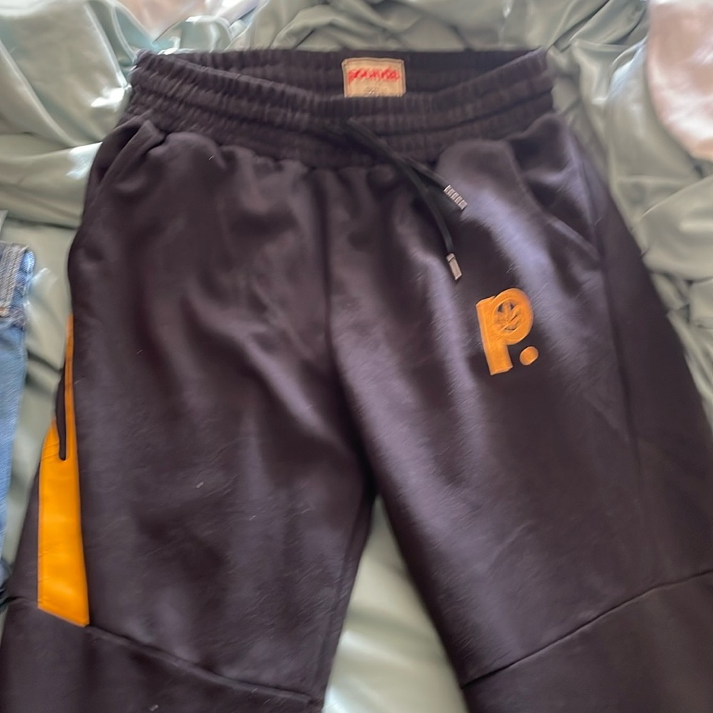 POUNDS black with yellow accents zipper pockets